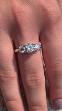 Load and play video in Gallery viewer, Moissanite Round Cut 3 Stone Solitaire Ring w/ Platinum Plated Sterling Silver