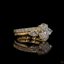 Load image into Gallery viewer, The Juliet Bridal Set | 2ct Oval Lab Diamond | Pear Side Stones | Pavé Band | 14k Yellow Gold
