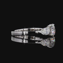 Load and play video in Gallery viewer, The Clara Ring — 1.50ct Round with Pear Accents Three-Stone
