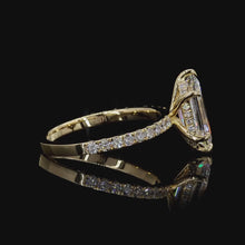 Load and play video in Gallery viewer, The Cassiel Ring | 2.5ct Hexagonal Step Cut Lab Diamond | Hidden Halo | Pavé Band | 14k Yellow Gold
